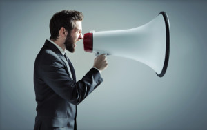 Conceptual photo of manager yelling over the megaphone